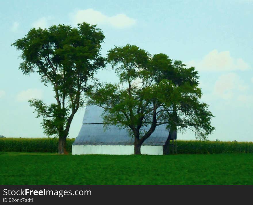 A wood and tin barn between 2 fields. A wood and tin barn between 2 fields.