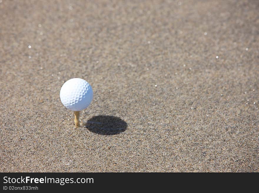 Golf ball in the beach