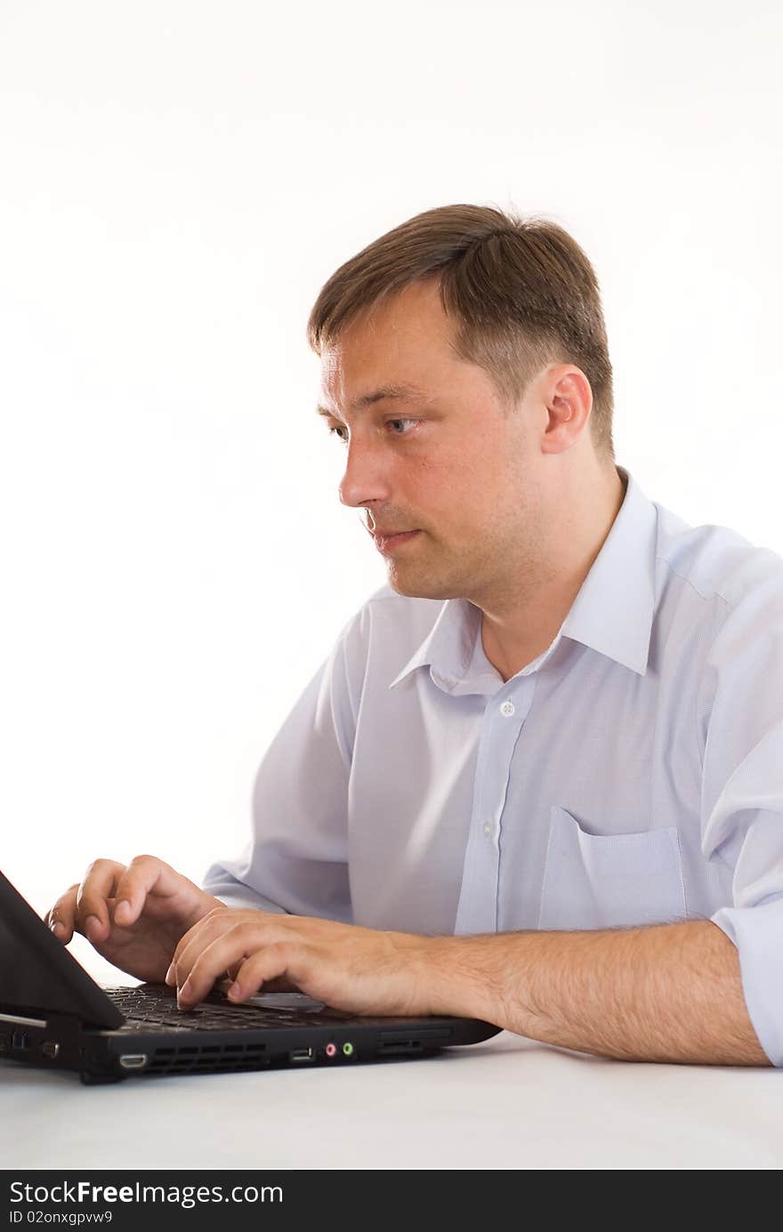 Businessman with laptop on white