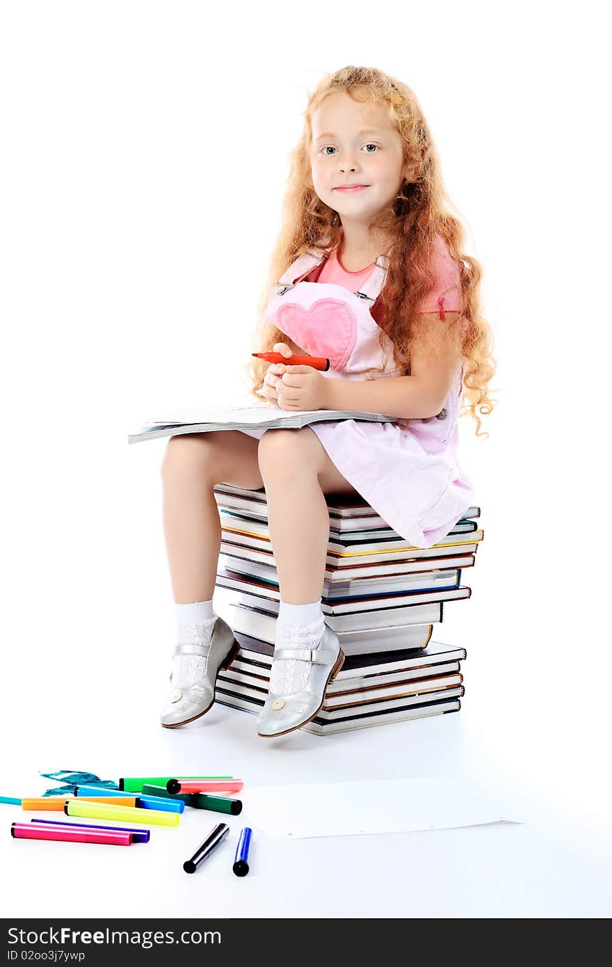 Portrait of a little girl sitting on a stack of books. Over white background. Portrait of a little girl sitting on a stack of books. Over white background.