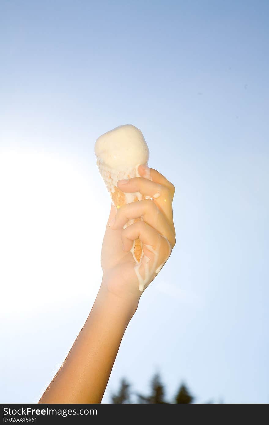 Hand holding icecream in summer