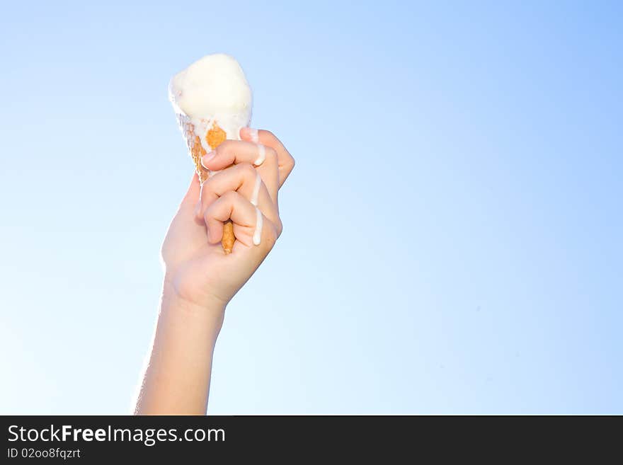 Hand holding icecream in summer