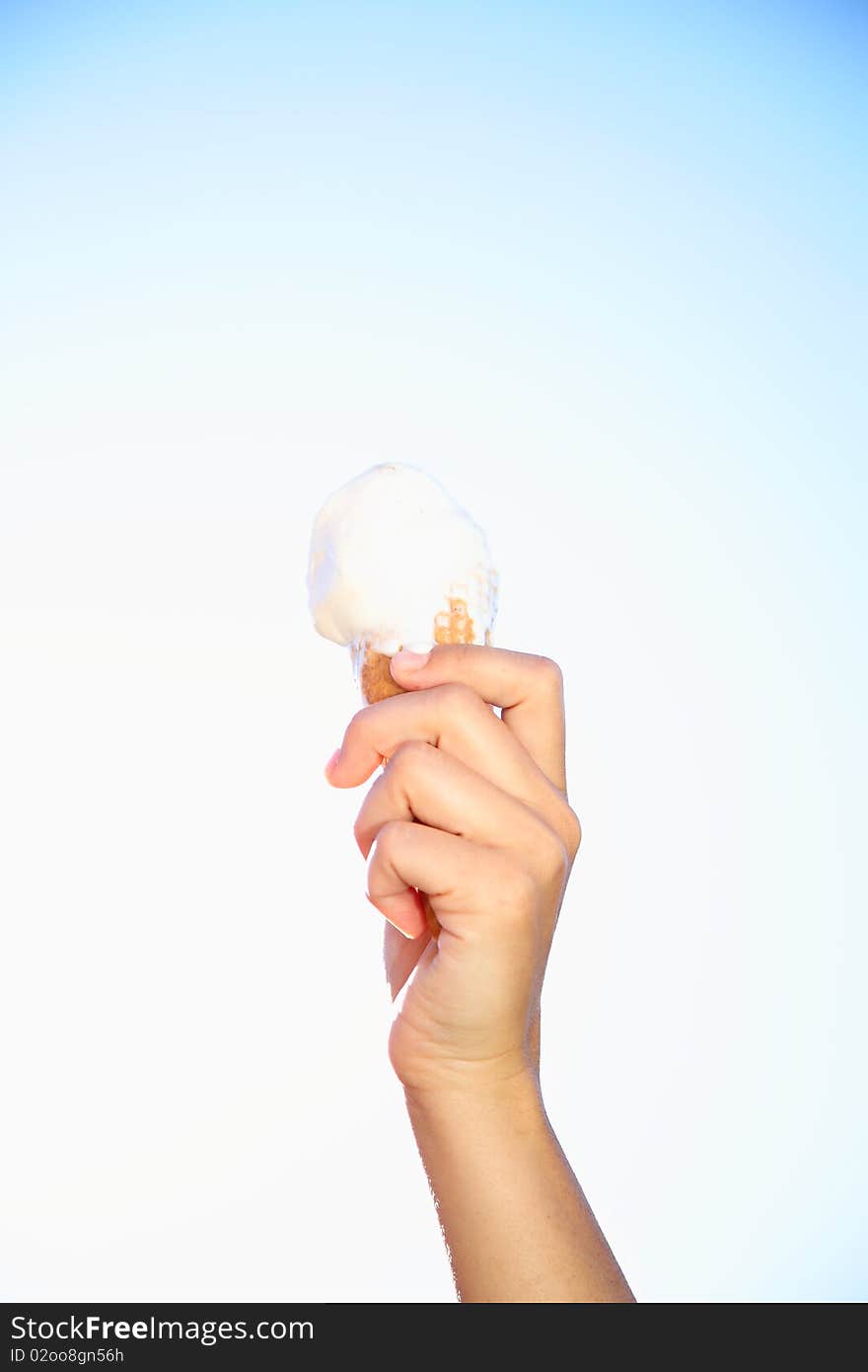 Hand holding icecream in summer