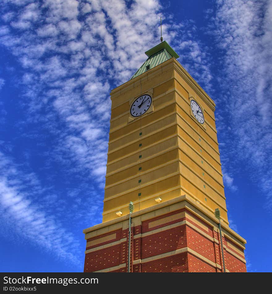 Spectacular persective of a modern clock tower with vibrant sky. Spectacular persective of a modern clock tower with vibrant sky