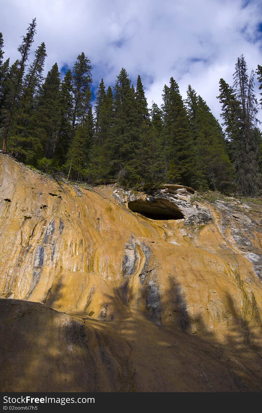 Cave on red cliff of Johnson Canyon, Banff, Alberta, Canada