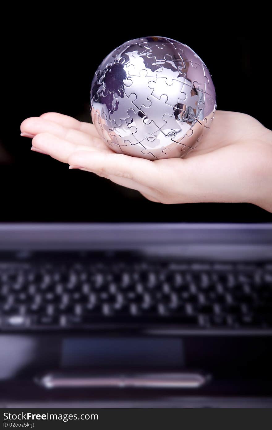 Business woman holding a puzzle globe. Business woman holding a puzzle globe