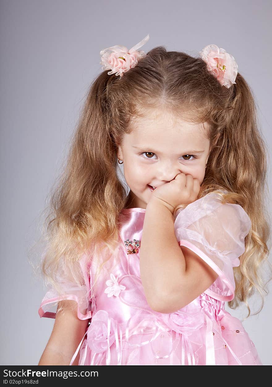 Beautiful young smiling girl. Studio shot.