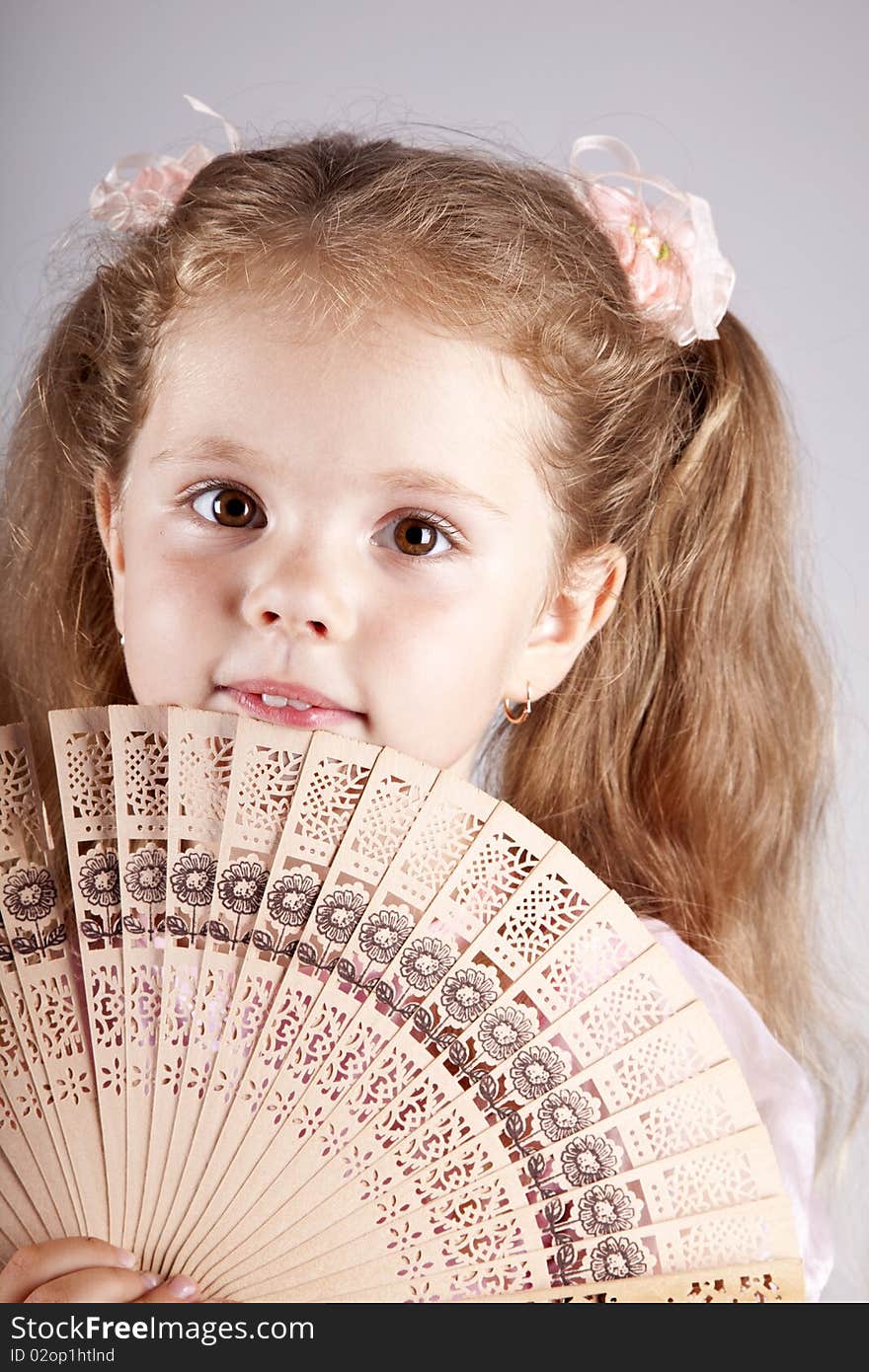 Portrait Of Beautiful Young Girl With Fan