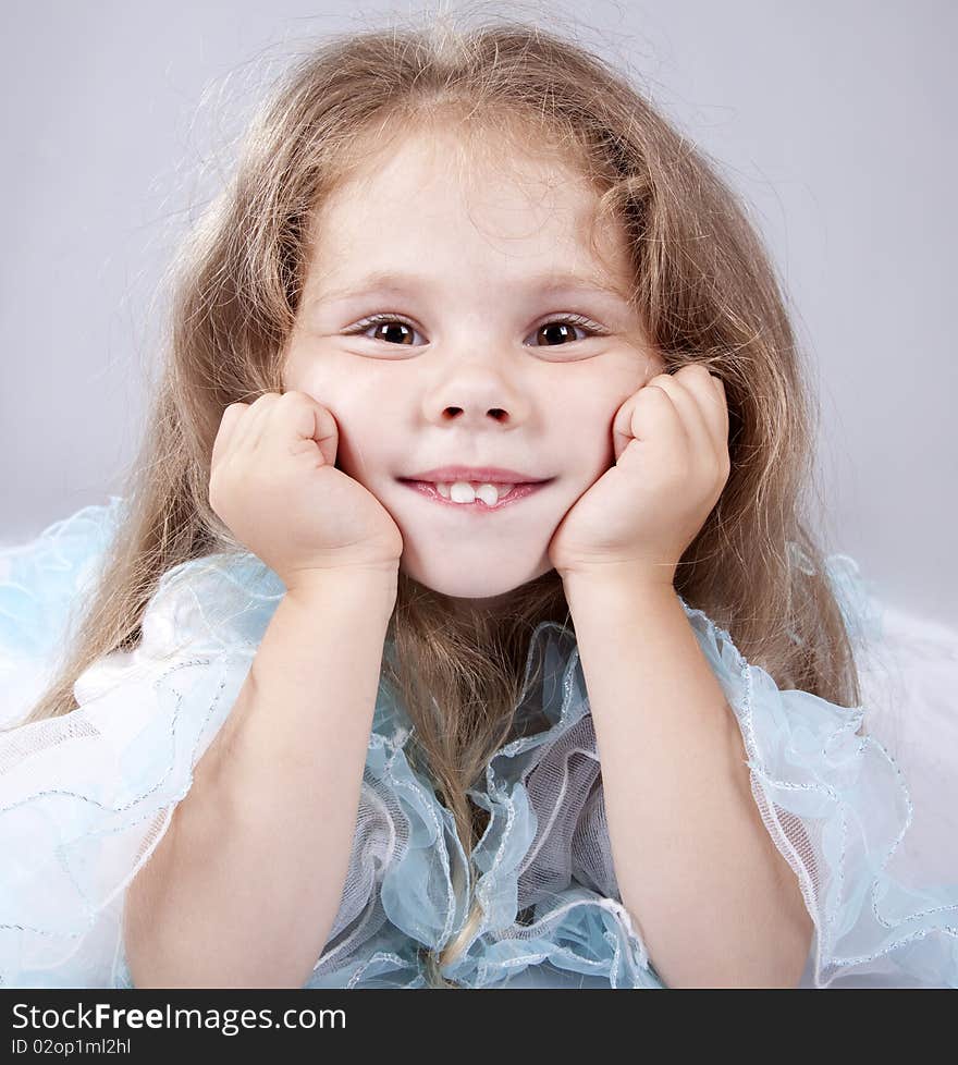 Portrait of beautiful little girl. Studio shot.