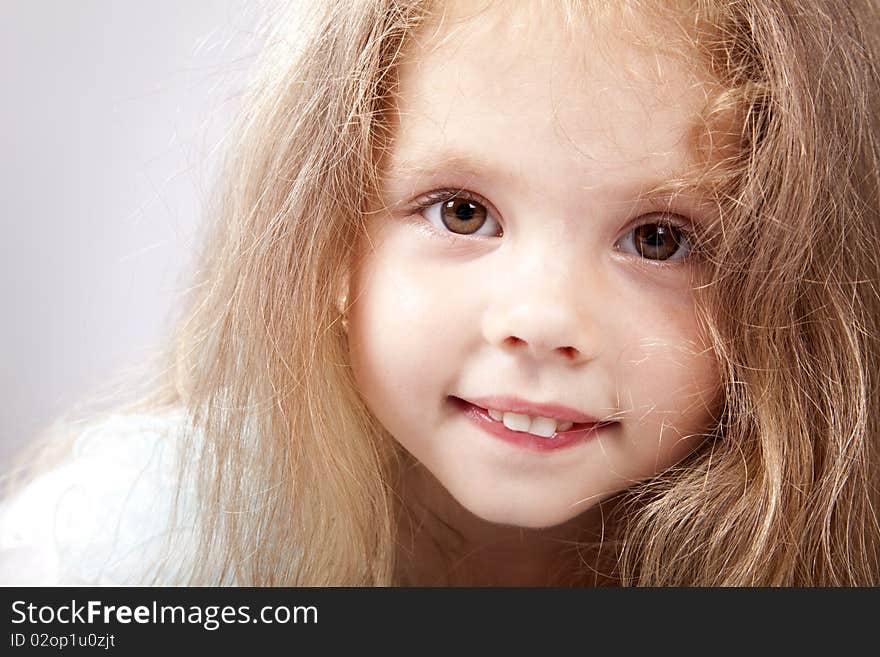 Portrait of beautiful little girl. Studio shot.