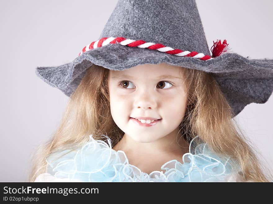 Beautiful young smiling girl in cap