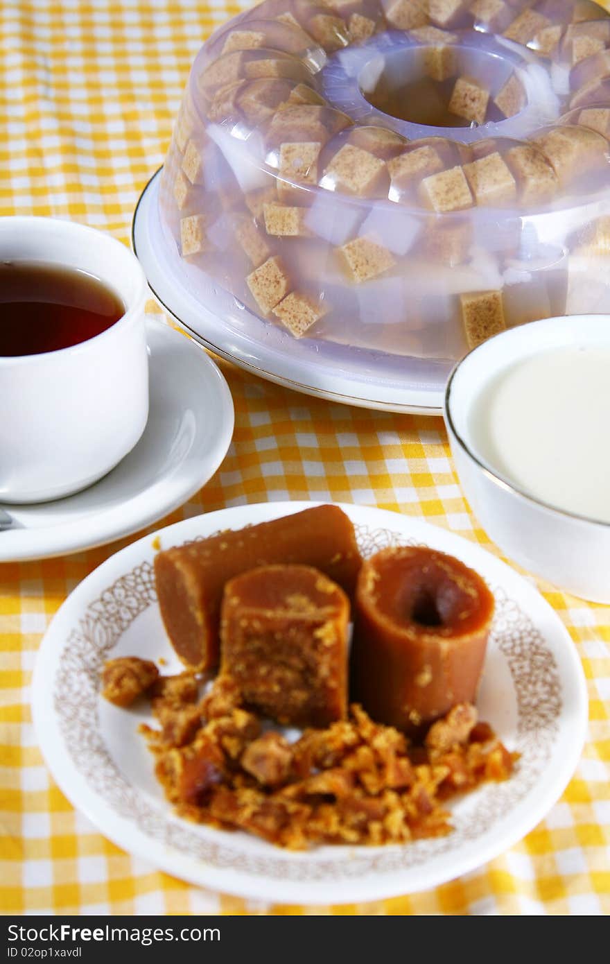 Coconut and red sugar pudding with tea and vanilla sauce. Coconut and red sugar pudding with tea and vanilla sauce