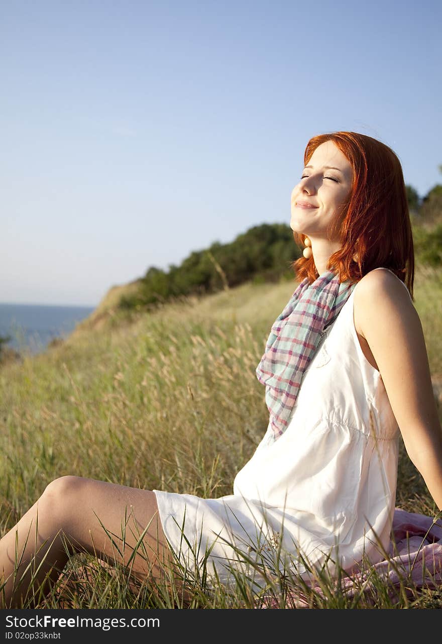 Girl at hill in sunrise.