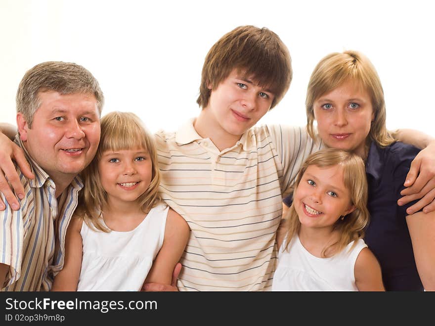 Portrait of a happy family of five on a light background