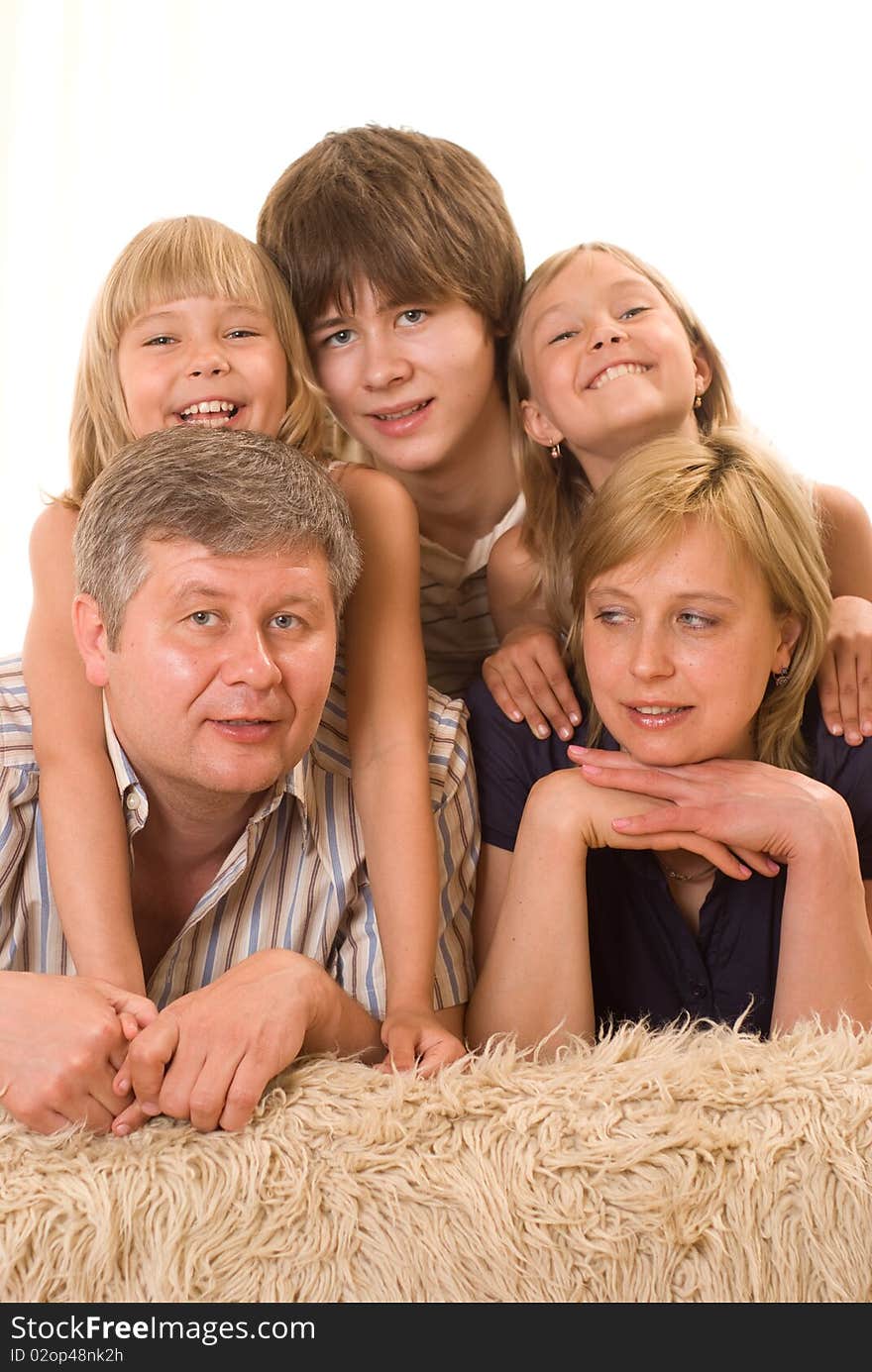 Portrait of a happy family of five on a light background