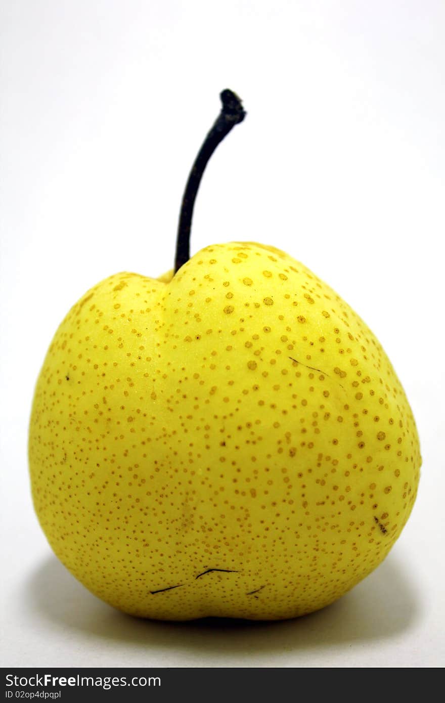 Fresh yellow pear on white background