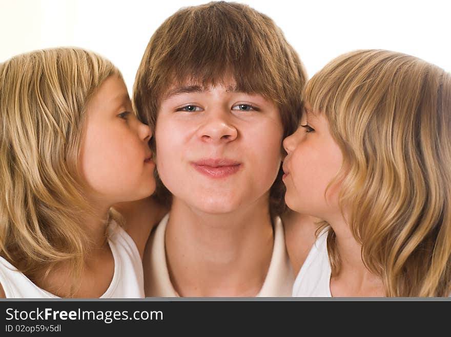 Teenager with her sisters on a white background. Teenager with her sisters on a white background