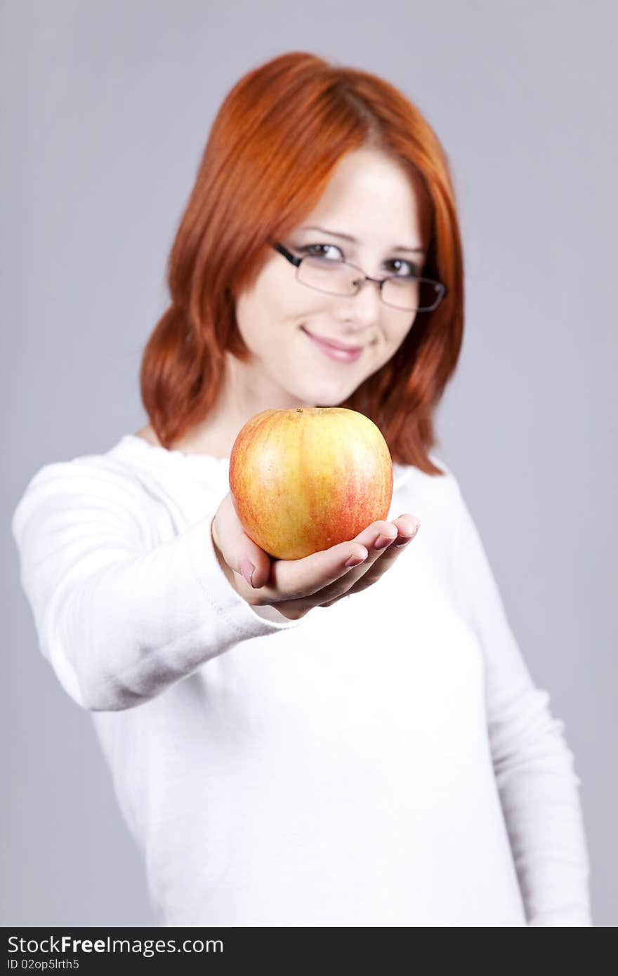 Girl with apple in hand.