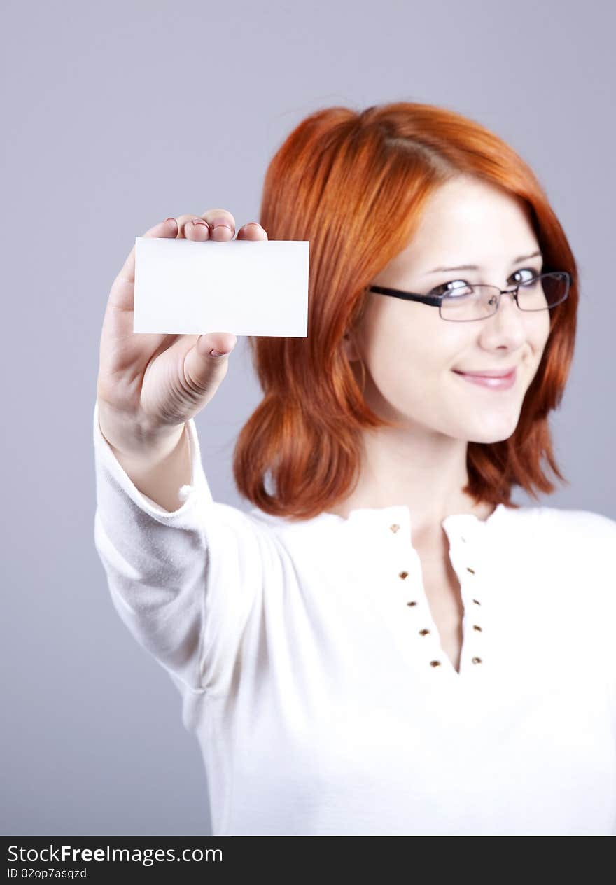 Portrait of an young woman with blank white card