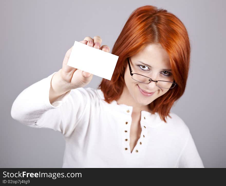 Portrait of an young woman with blank white card