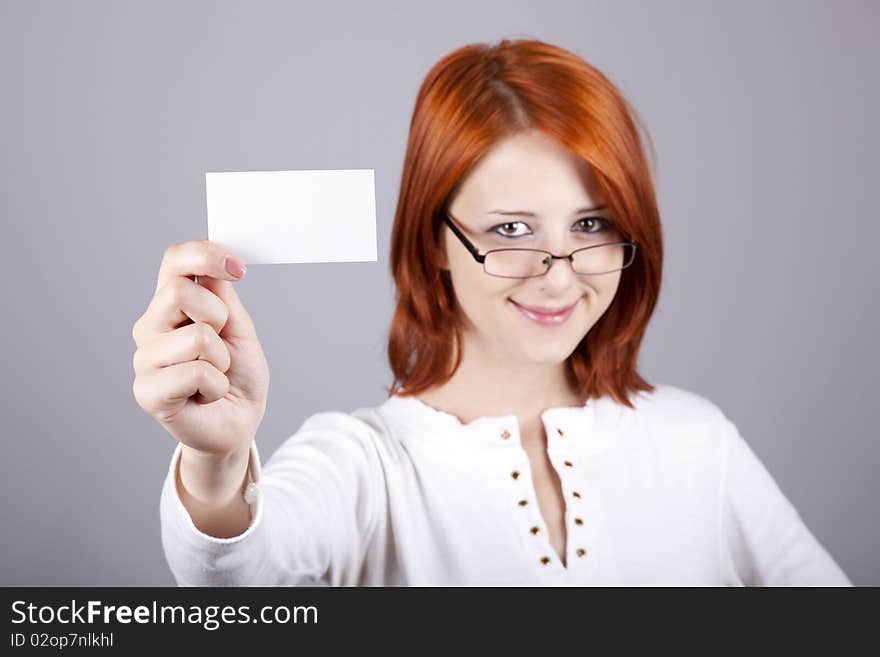 Portrait of an young woman with blank white card