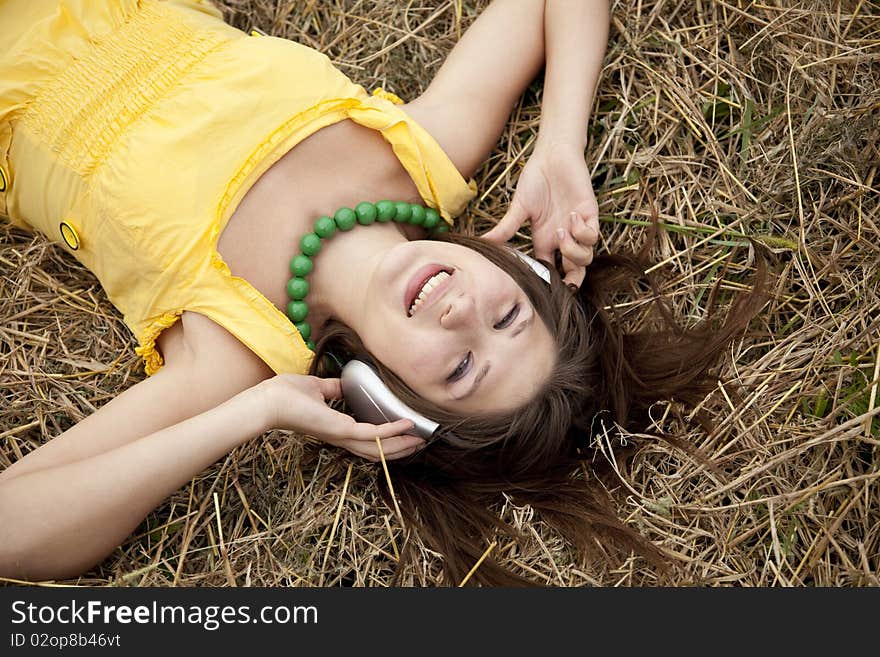 Young Beautiful Girl In Yellow With Headphones