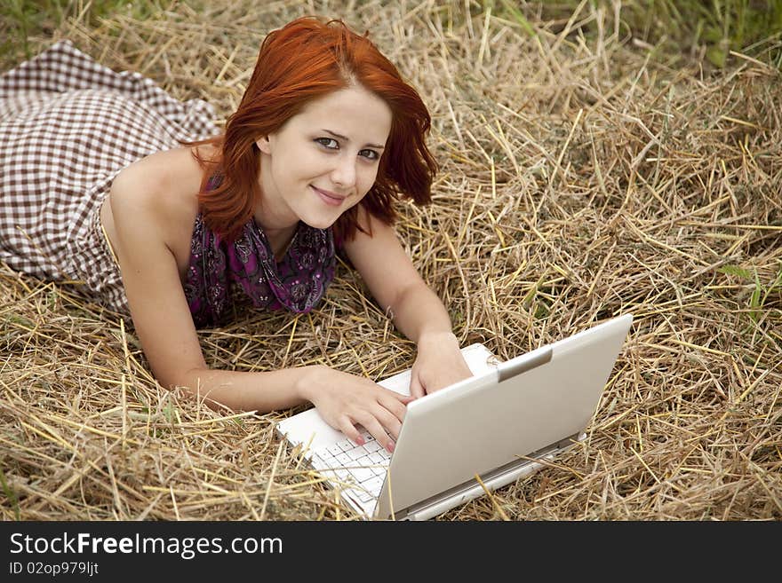 Young  Fashion Girl With Notebook Lying At Field