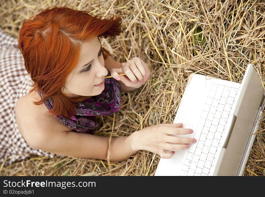 Young  Fashion Girl With Notebook Lying At Field