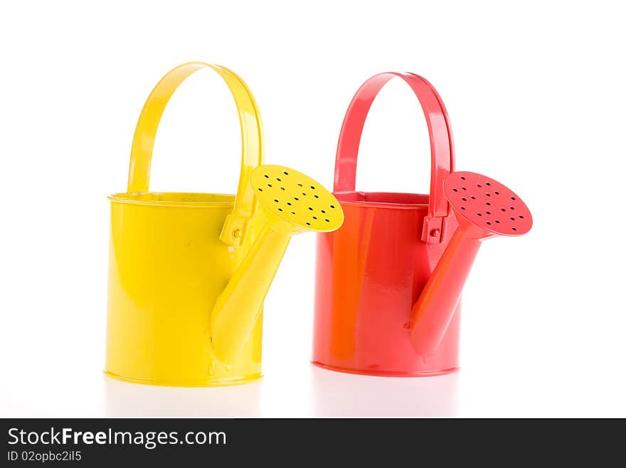 Two watering cans. Studio shot on a white background.