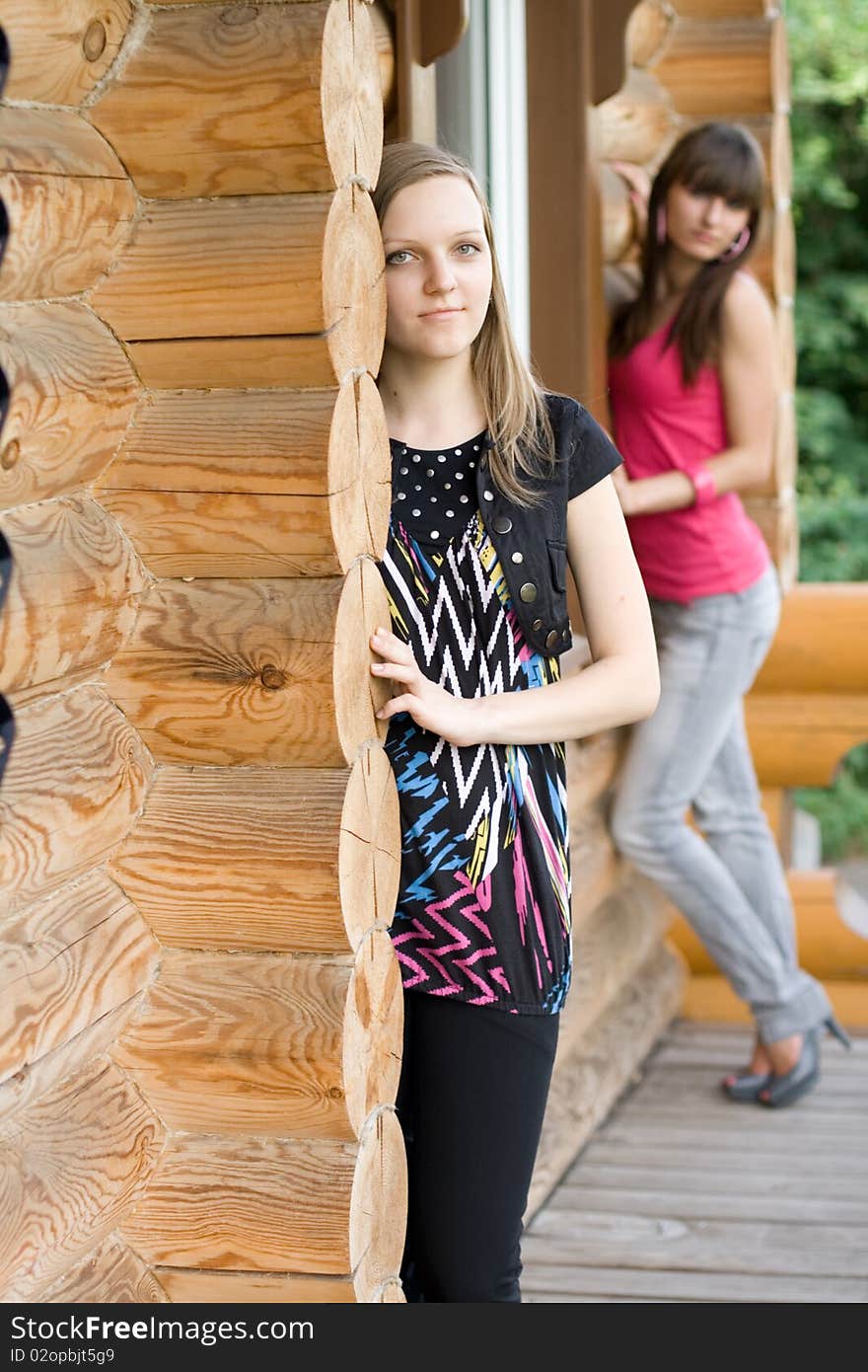 Two female friends on a veranda