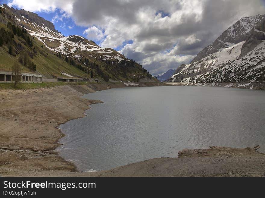 Lake on top of the Fedajapass in the dolomites