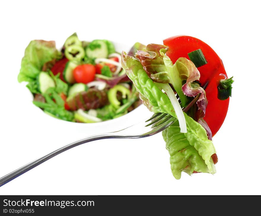 Mixed vegetable salad - lettuce, tomato, cucumber, onion, pepper,herb - isolated on white. Mixed vegetable salad - lettuce, tomato, cucumber, onion, pepper,herb - isolated on white