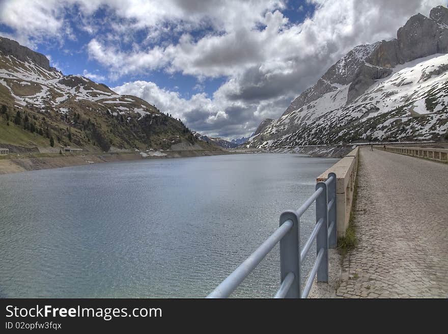 Lake on top of the Fedajapass in the dolomites