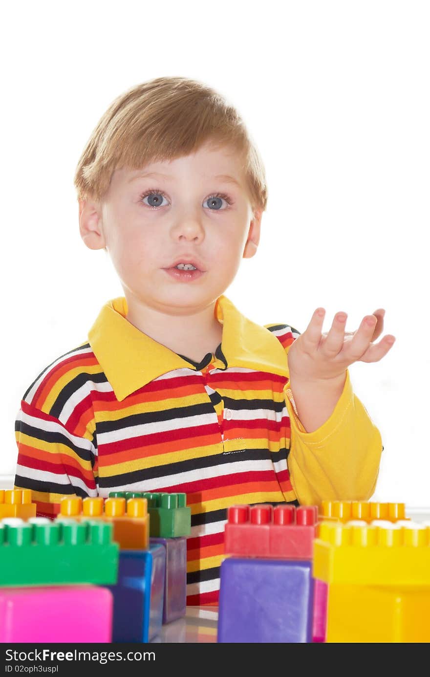 The beautiful little boy poses on white background. The beautiful little boy poses on white background