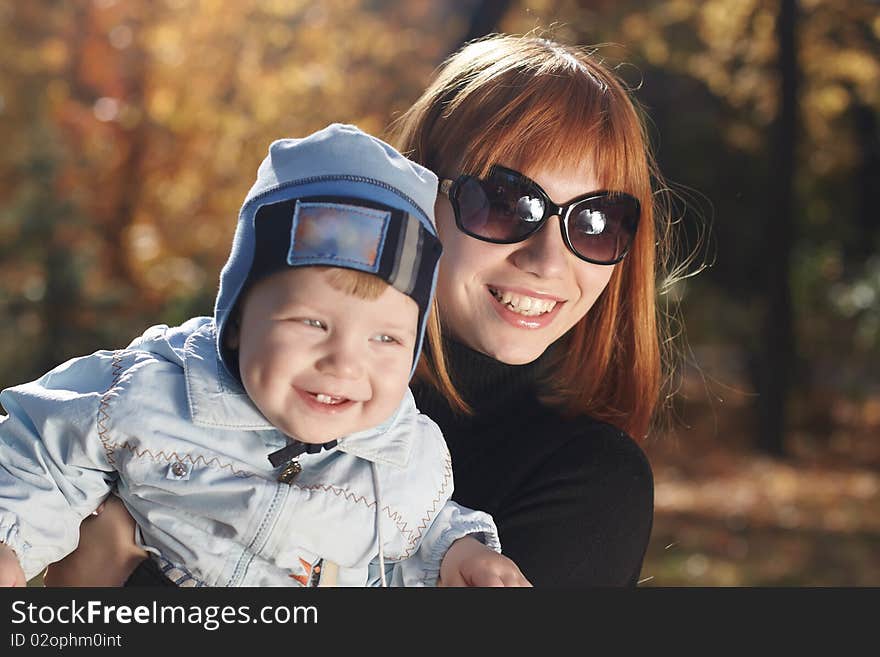 Baby boy with mother play in park. Baby boy with mother play in park