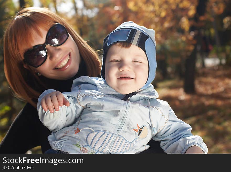 Baby boy with mother play in park. Baby boy with mother play in park