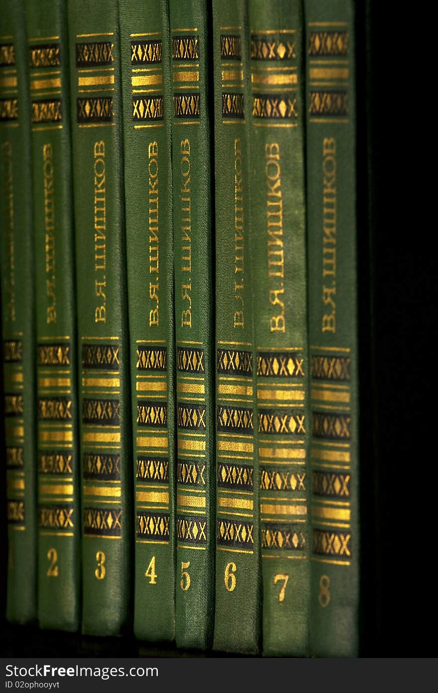 The green and gold book on the shelf. The green and gold book on the shelf