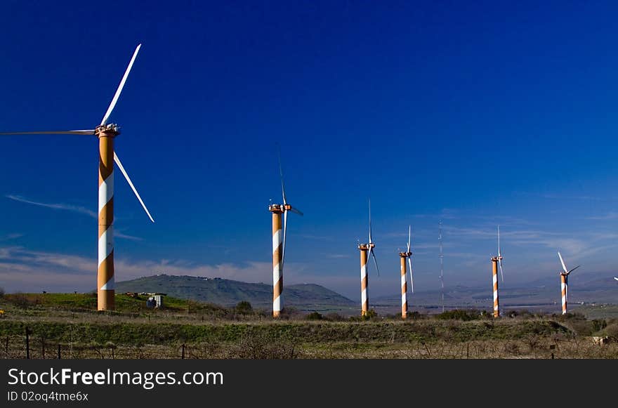 Wind turbines at work generating electricity for 2000 homes. Wind turbines at work generating electricity for 2000 homes