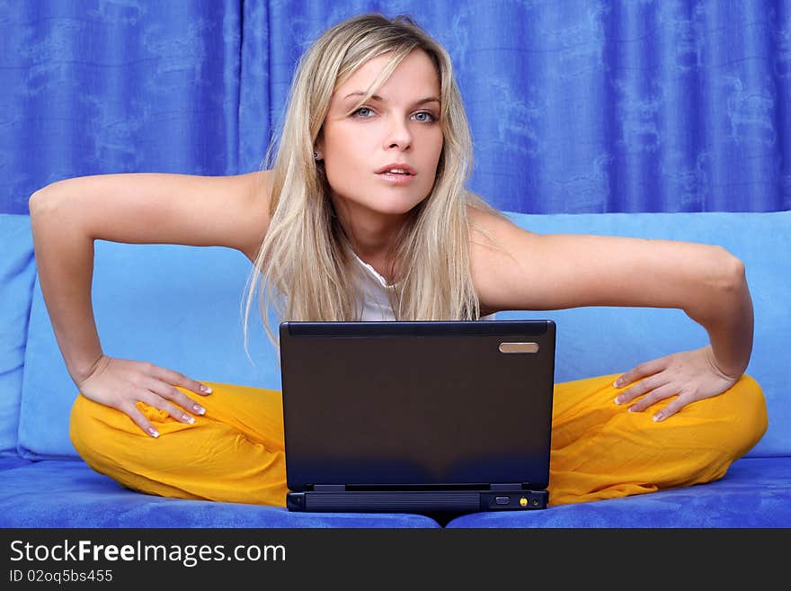 Woman working with PC at home in sofa