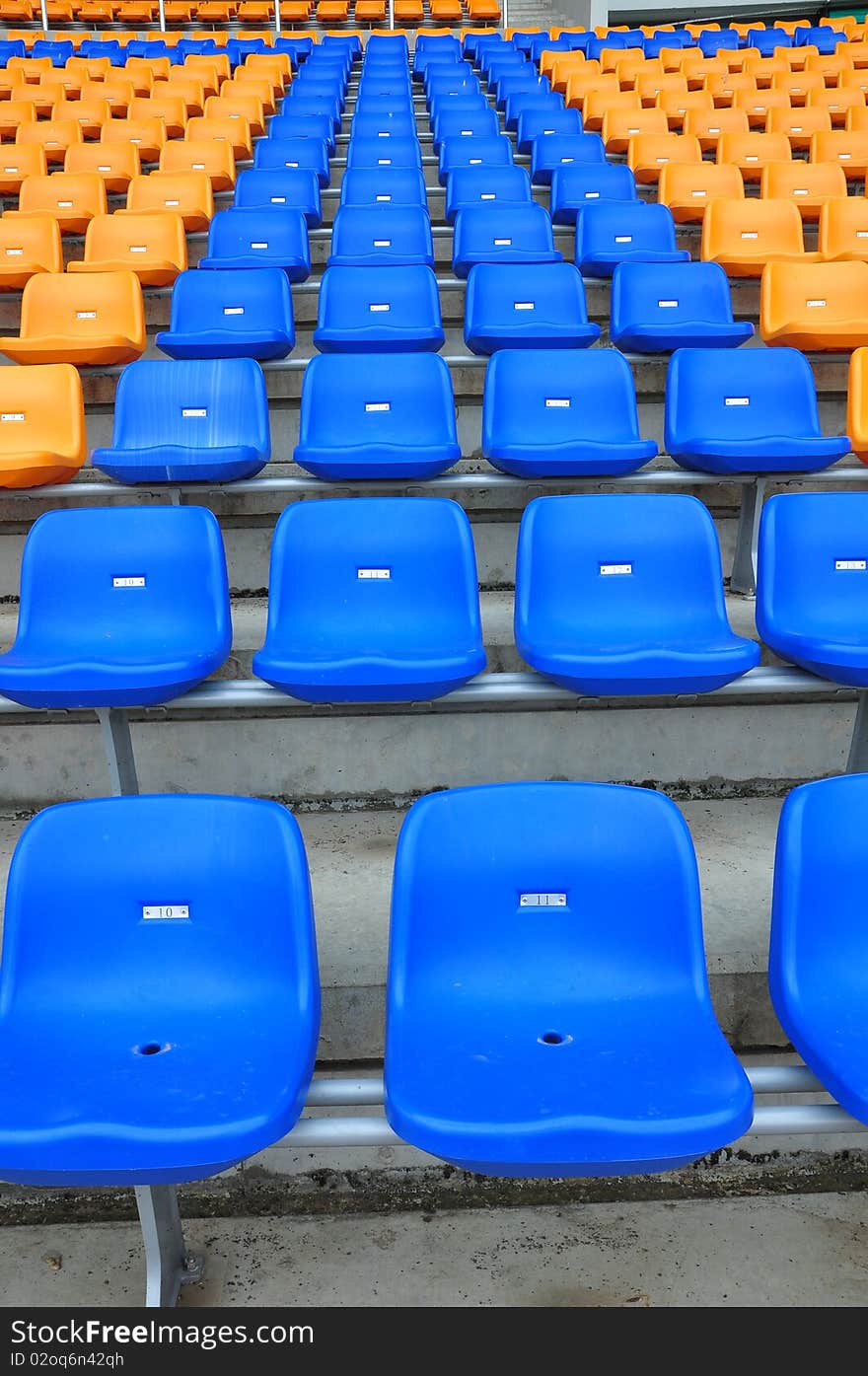 Blue and orange color seat in football stadium