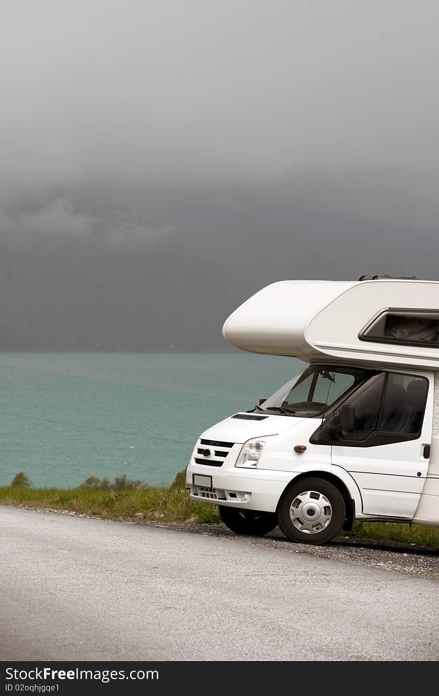 picture of a motorhome in norwegian mountains on a  fjord. picture of a motorhome in norwegian mountains on a  fjord