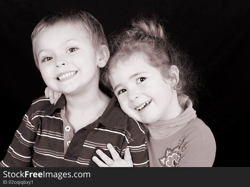 Beautiful young girl with curly hair and her cute boy friend. Beautiful young girl with curly hair and her cute boy friend