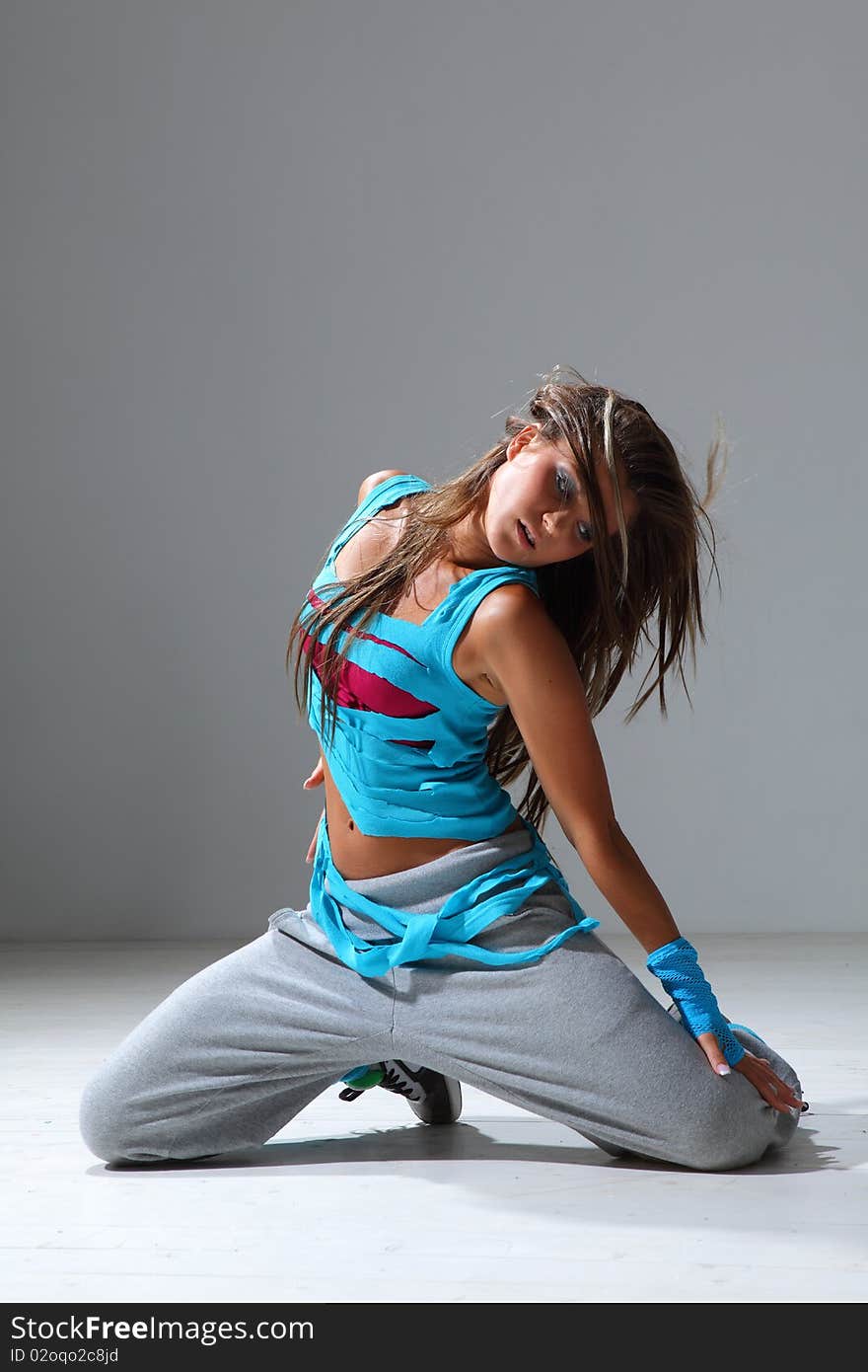 Modern style dancer posing on studio background. Modern style dancer posing on studio background