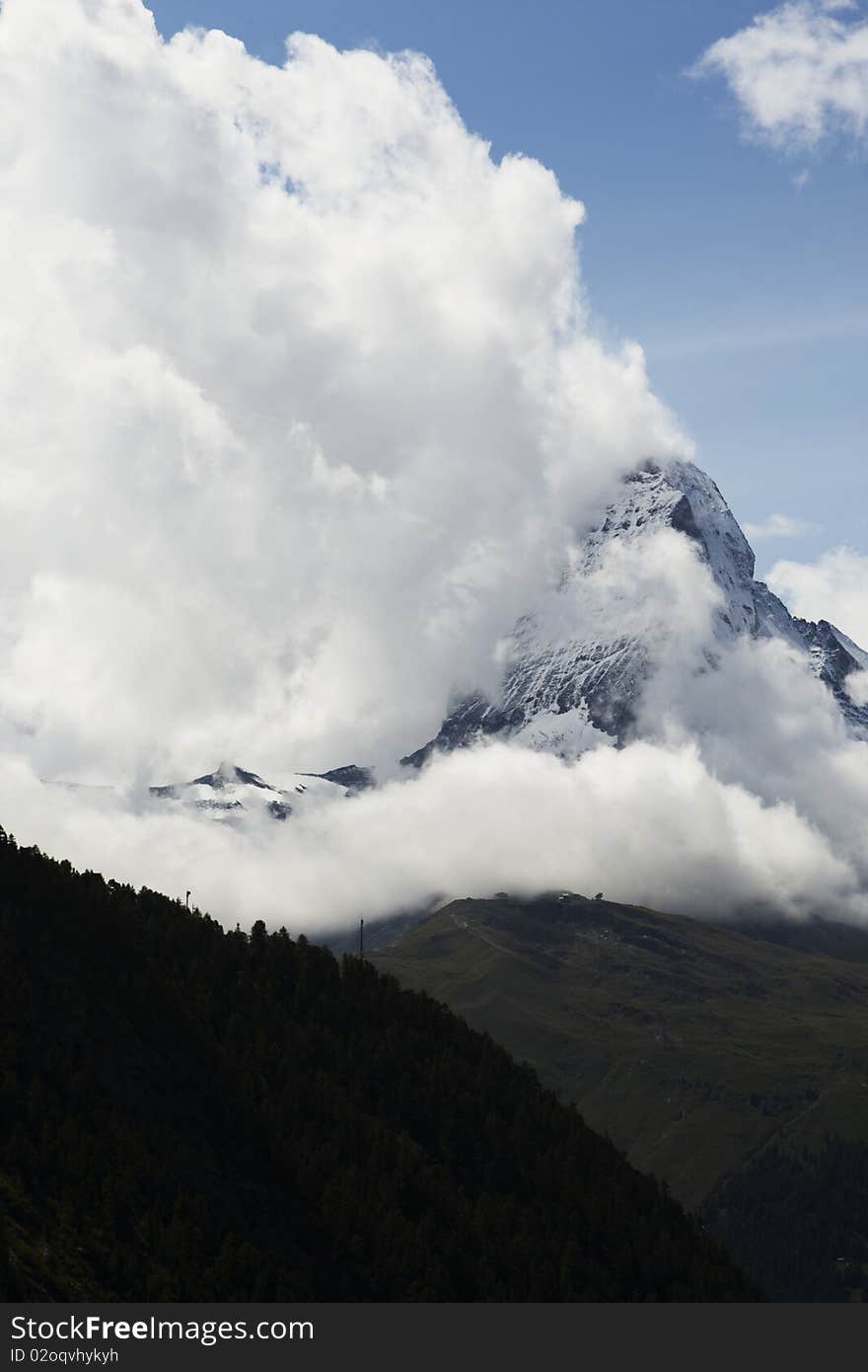 The symbol of the Alps - the Matterhorn in the clouds.