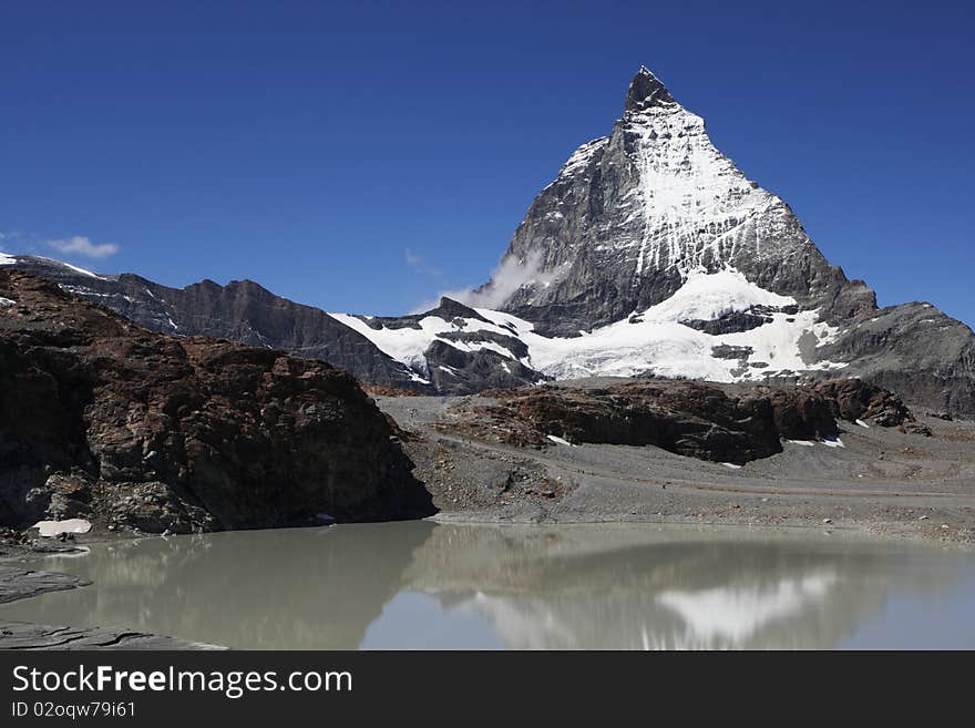 The symbol of the Alps - the Matterhorn, one of the lakes below.