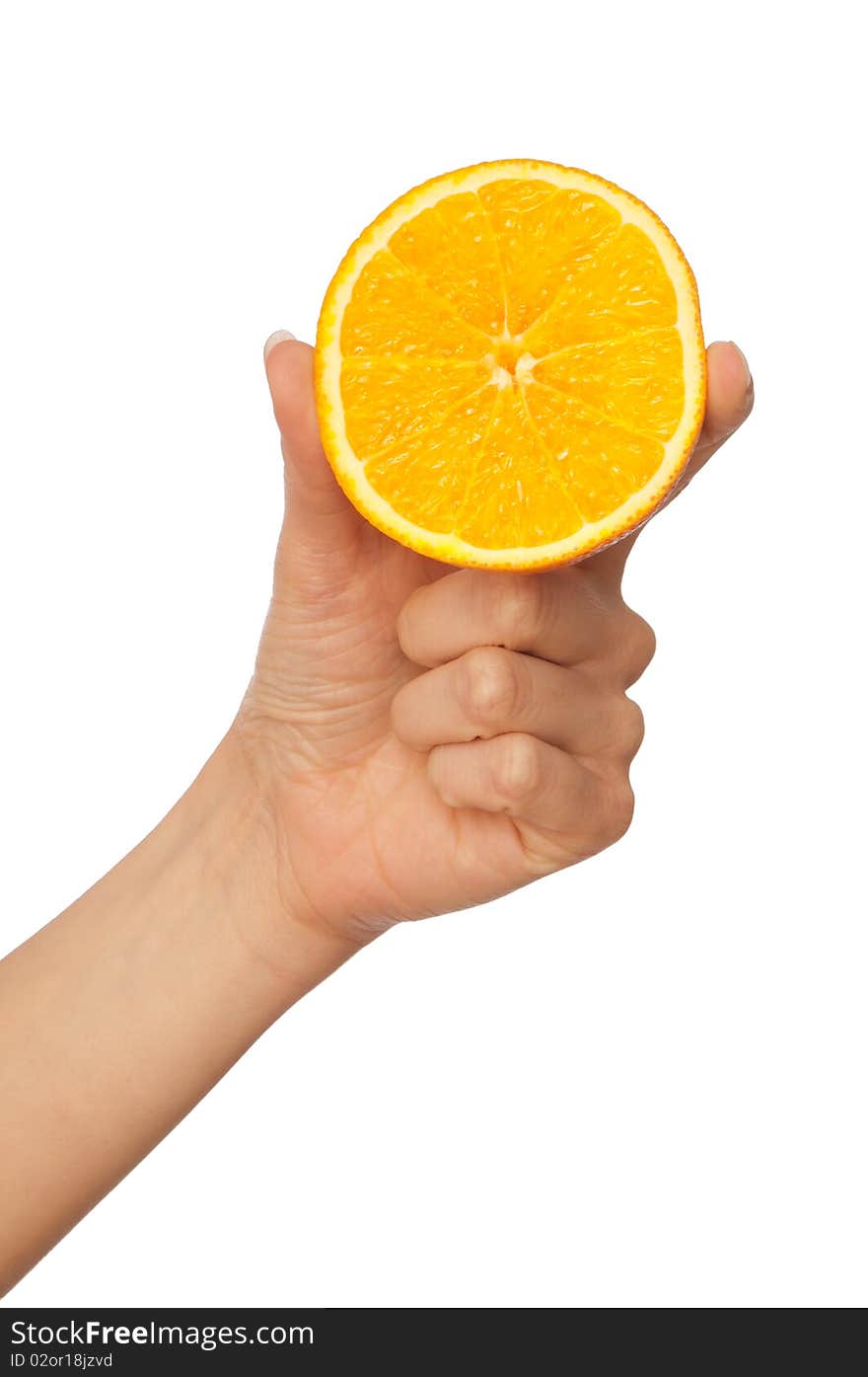 Slice of a fresh Sicilian orange in the hand