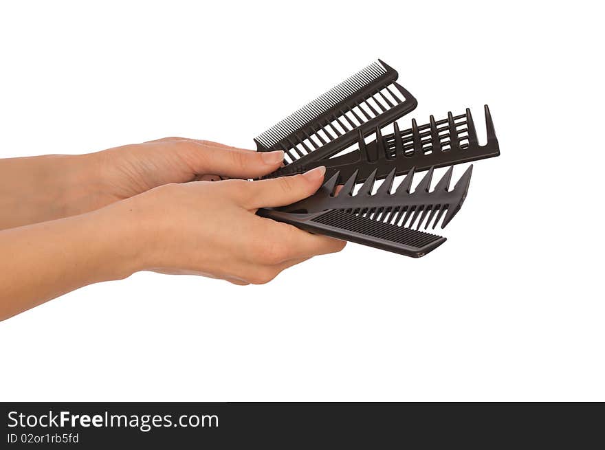 Hairdresser holds the black tools for haircut