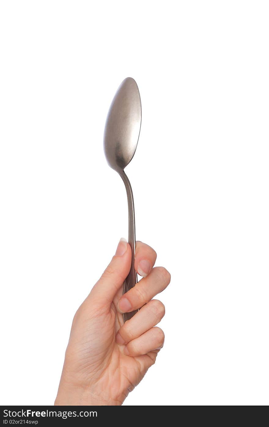 Woman holding tablespoon in the hand for feeding a sick person