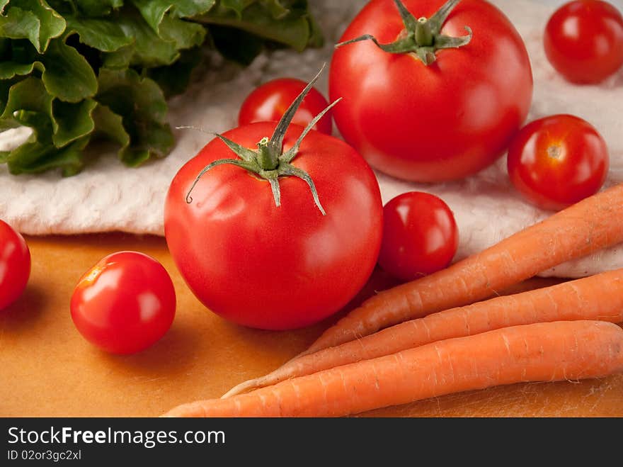 Close up of mixed vegetables of tomatoes, lettuces, carrots, and others. Close up of mixed vegetables of tomatoes, lettuces, carrots, and others