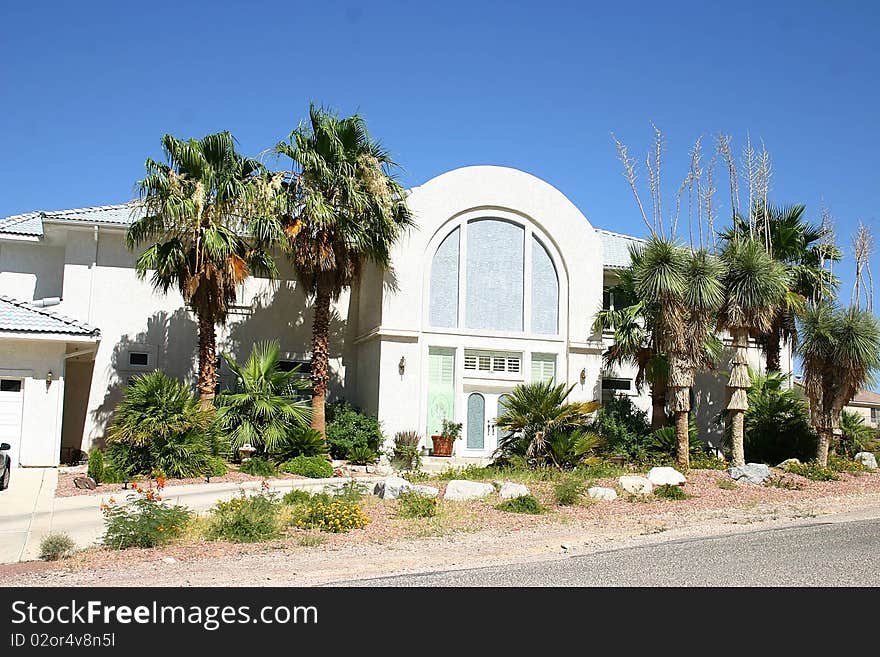 A slanted house the lovely desert landscaping. A slanted house the lovely desert landscaping.